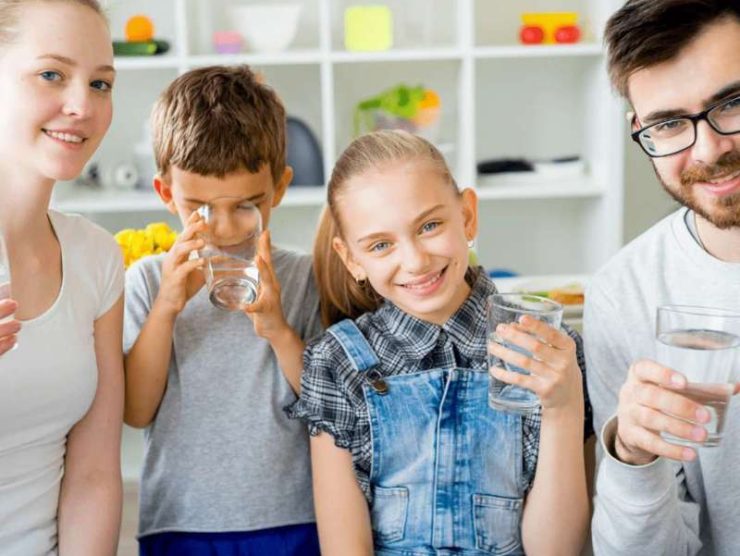 photo of family enjoy drinking clean water