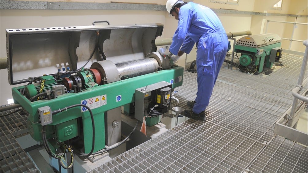 photo of technician service the sludge centrifuge
