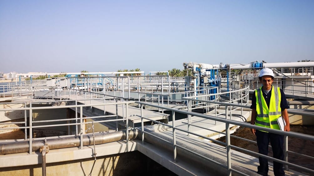 photo of an operator observing sewage treatment plant
