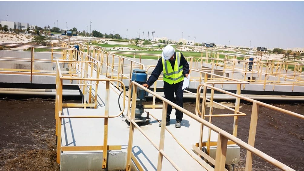 photo of an operator monitor a sewage treatment plant