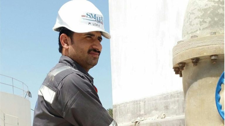 photo of an operator monitor a sewage treatment plant
